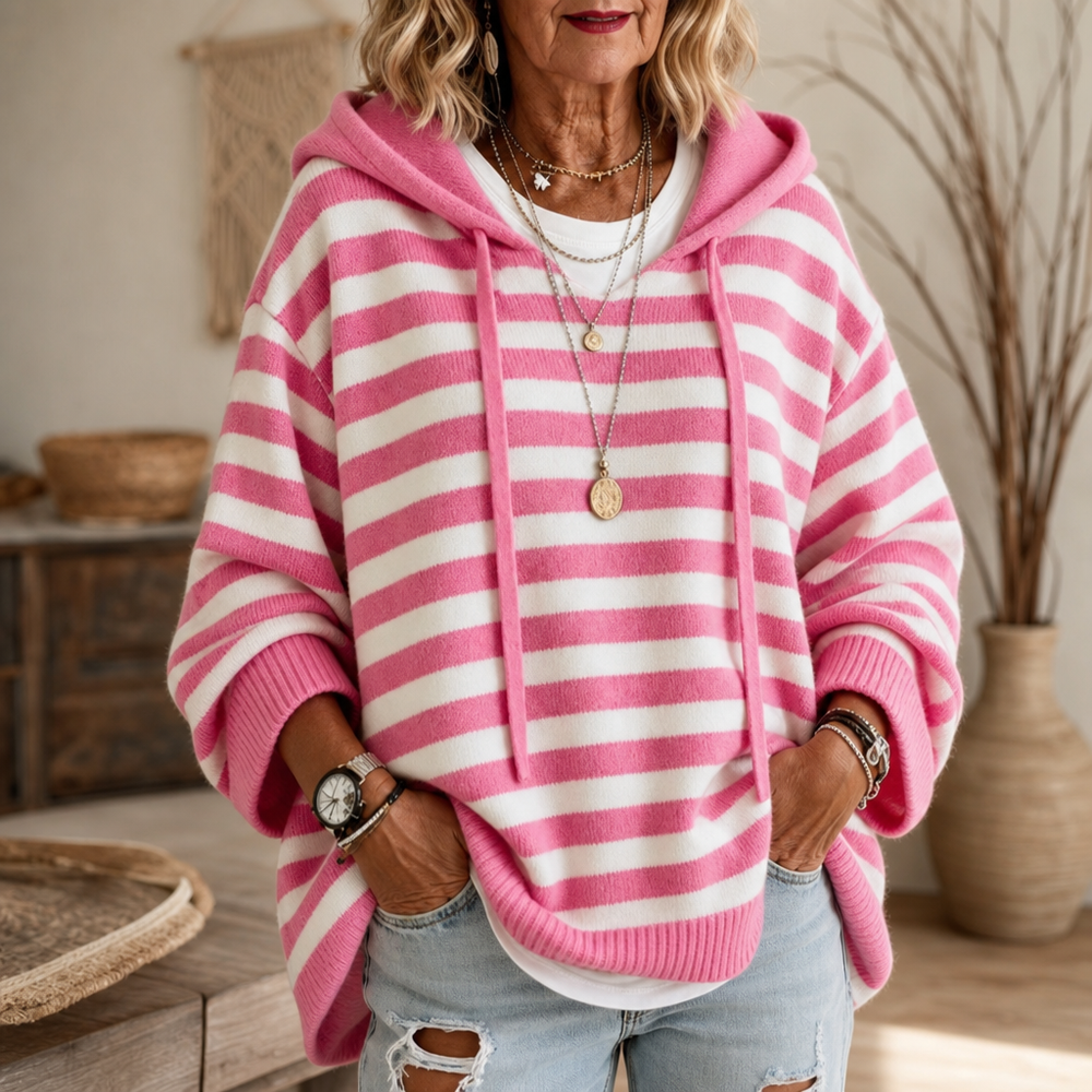 Harlowe oversized hooded sweater in pink stripe, walking pose