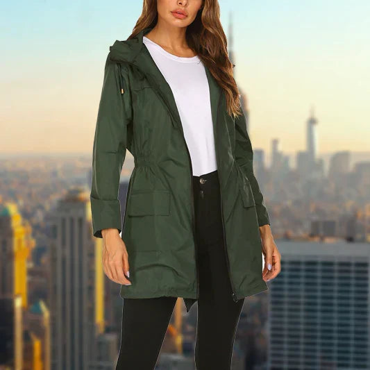 Harper hooded rain jacket in dark green, front view with hands in pockets
