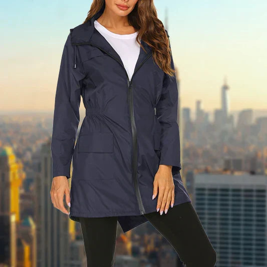 Harper hooded rain jacket in navy blue, front view with hands in pockets
