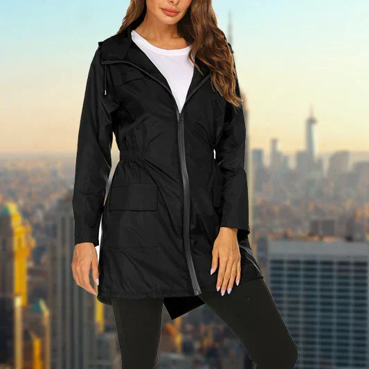 Harper hooded rain jacket in black, close-up front view with hand in pocket