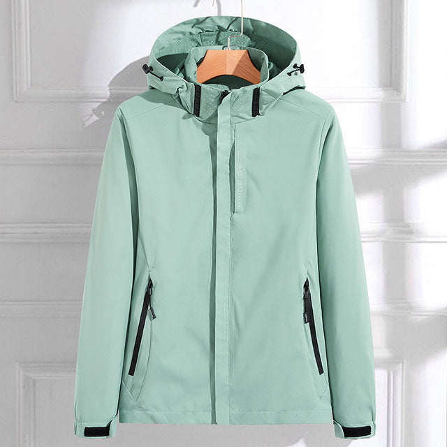 Harper hooded rain jacket in mint green, front view on hanger