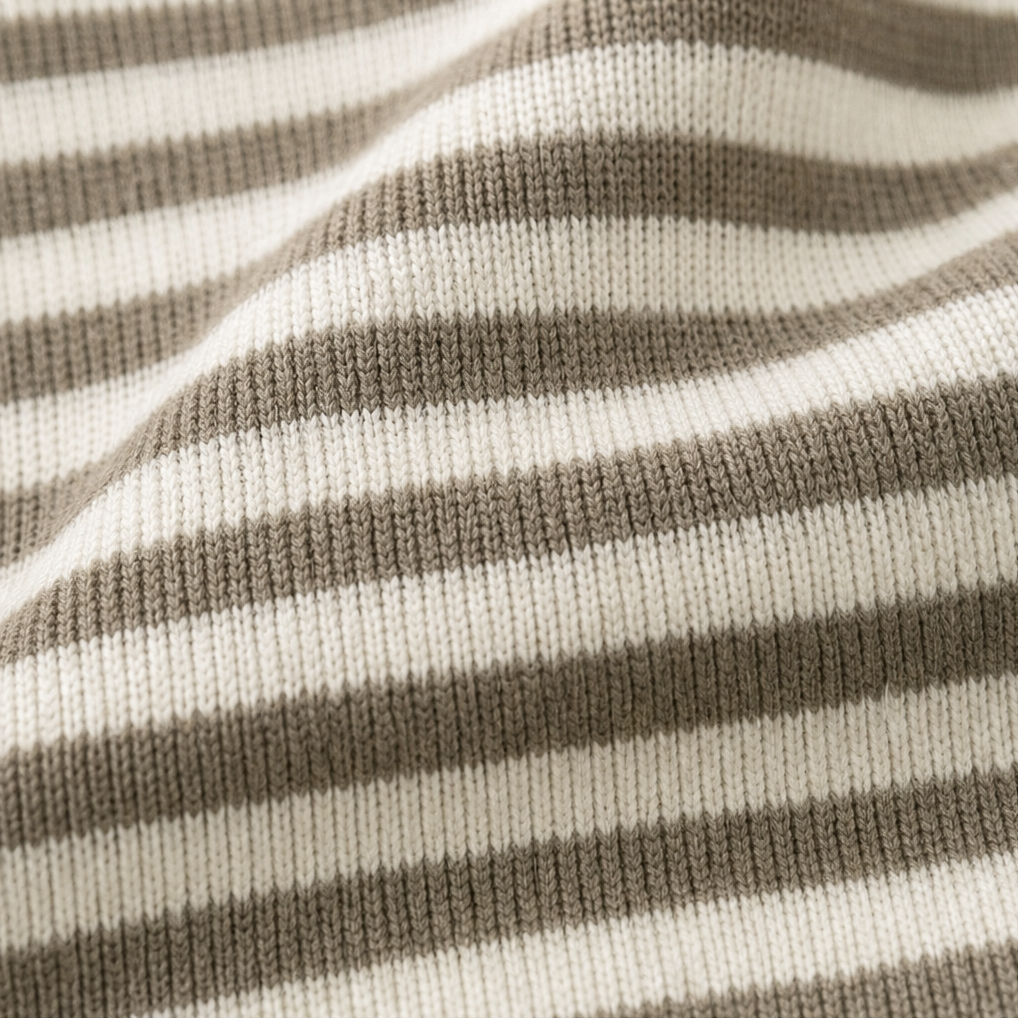 Josefina striped cardigan worn outdoors at a doorway, front view
