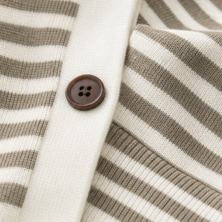 Josefina striped cardigan worn outdoors at a doorway, front view