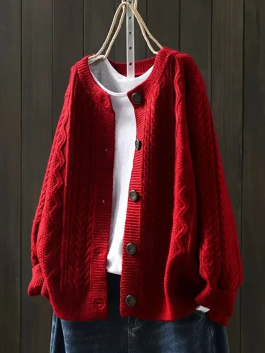 Josephine oversized cable knit cardigan in red, front view on hanger