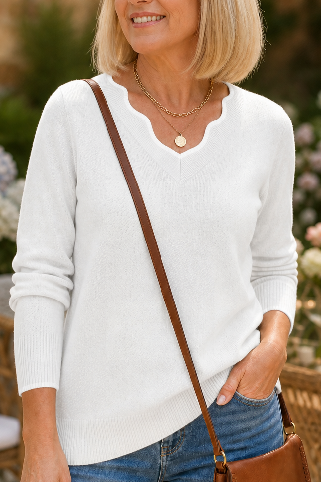 Josephine V-neck knit sweater styled with jeans and ankle boots, indoor setting