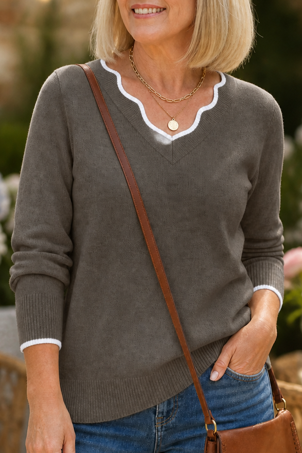 Josephine V-neck knit sweater styled with jeans and ankle boots, indoor setting