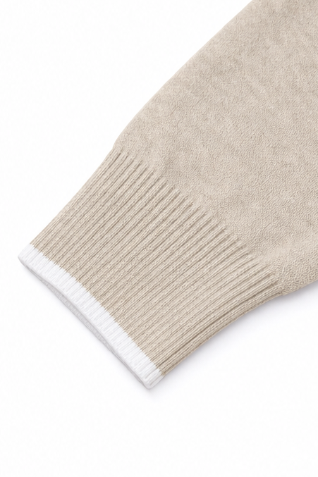 Josephine V-neck knit sweater styled with jeans and ankle boots, indoor setting