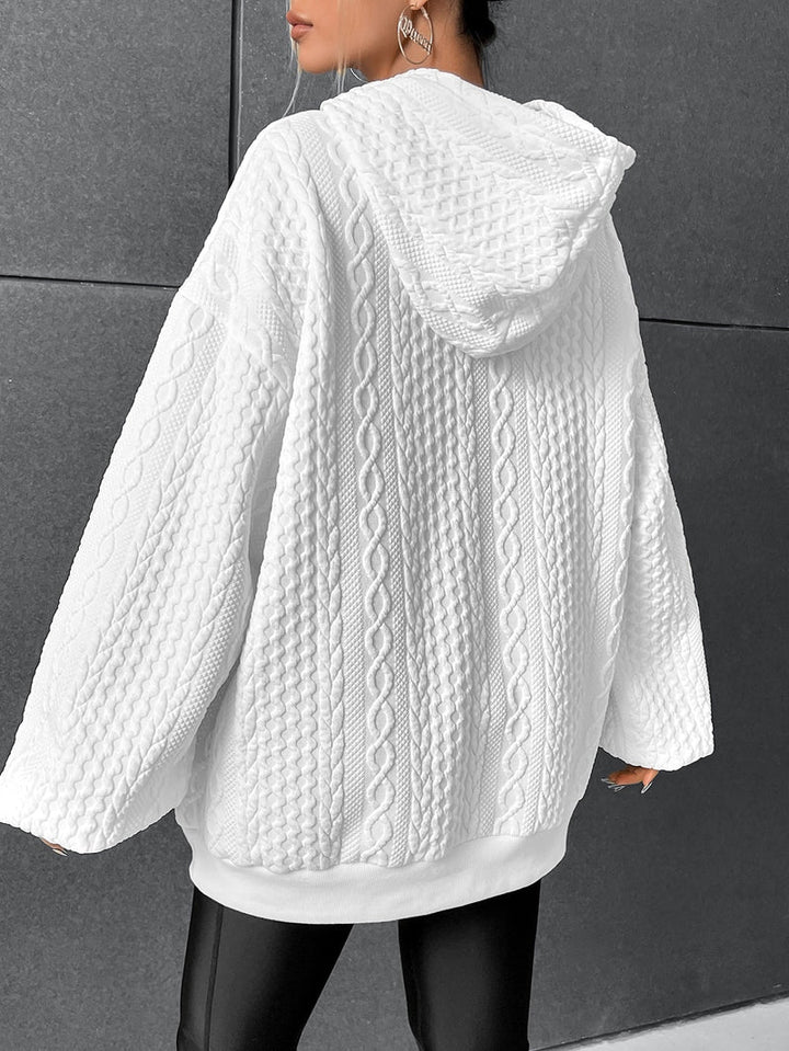 Kathryn oversized cable knit hoodie in white, back view with hood