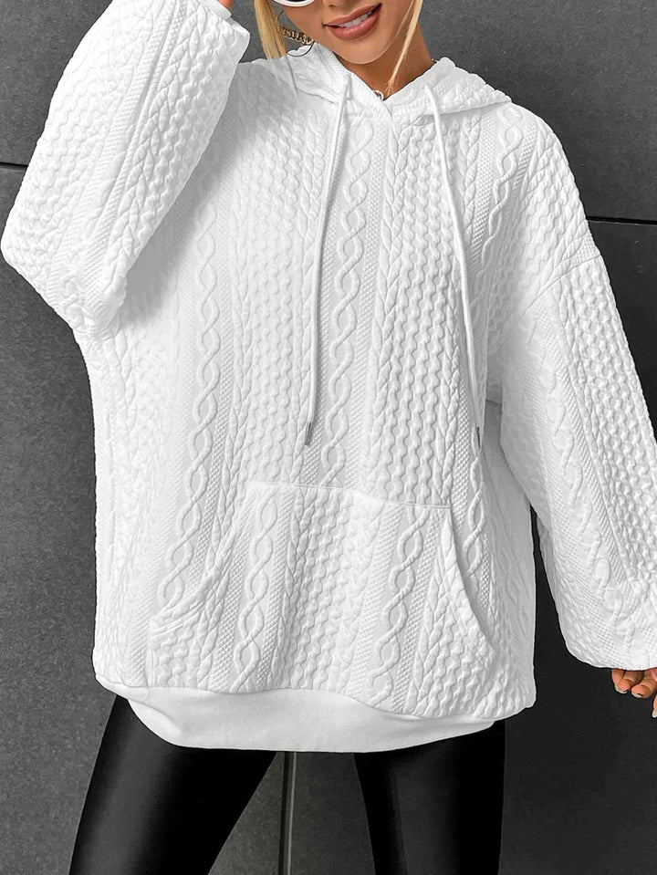 Kathryn oversized cable knit hoodie in white, front view with kangaroo pocket