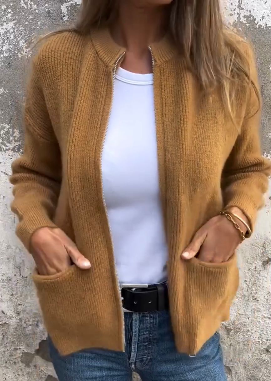 Linda zip-up cardigan in camel, front view with hands in pockets