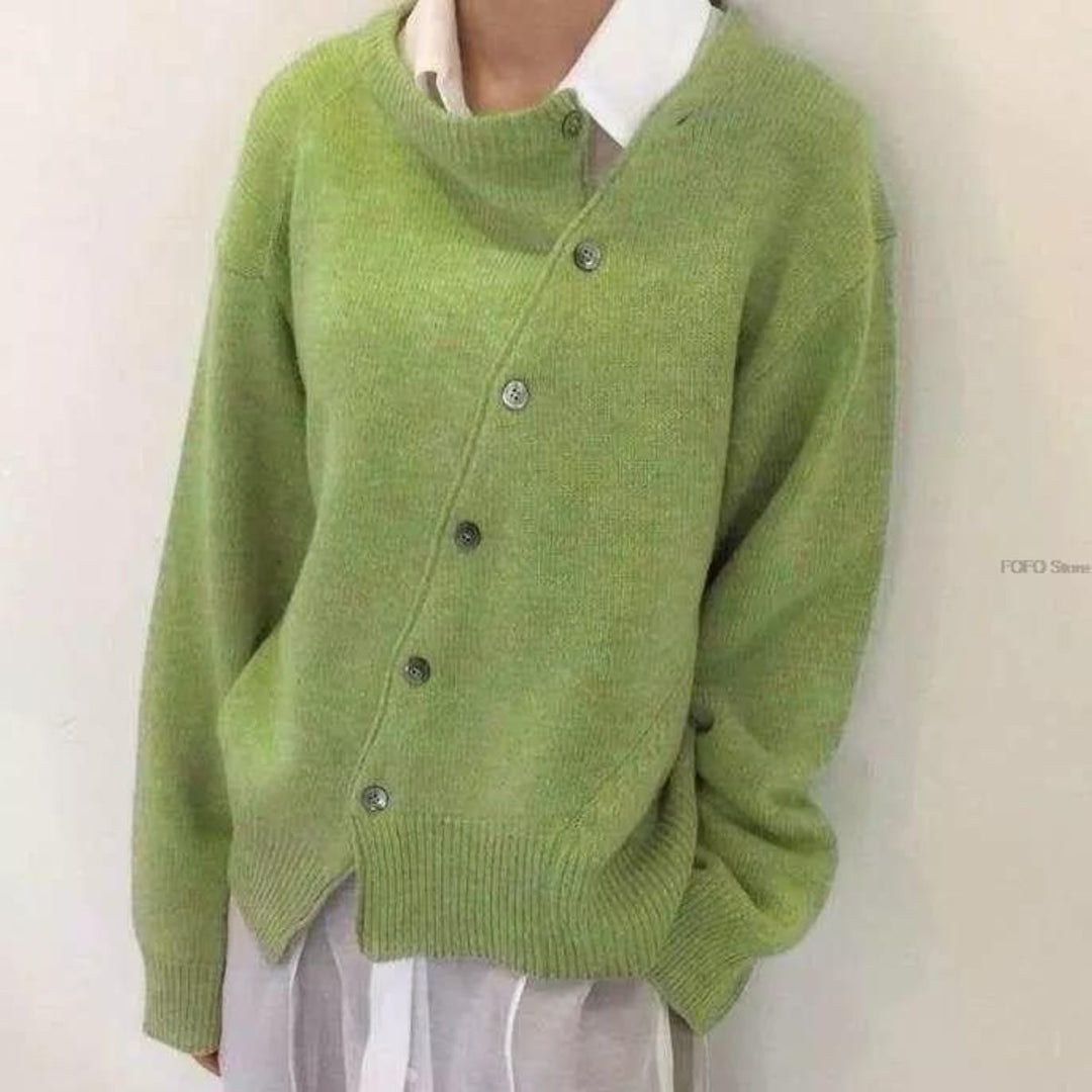Lucille asymmetric button cardigan in green, front view standing