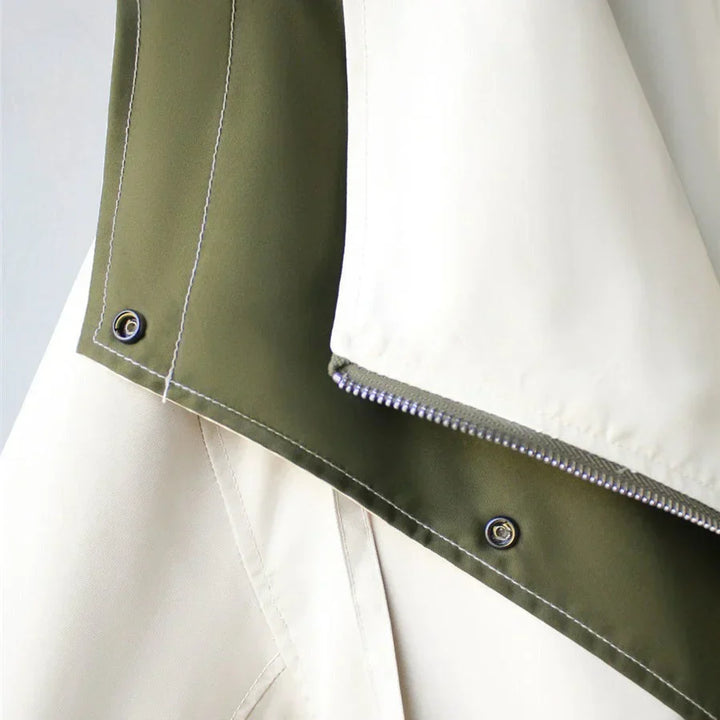 Close-up of zip and snap button closure detail on Margaux trench coat