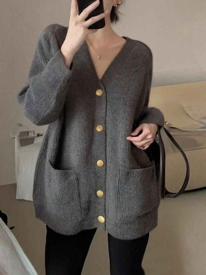Margeaux oversized V-neck cardigan with front pockets, styled with leggings