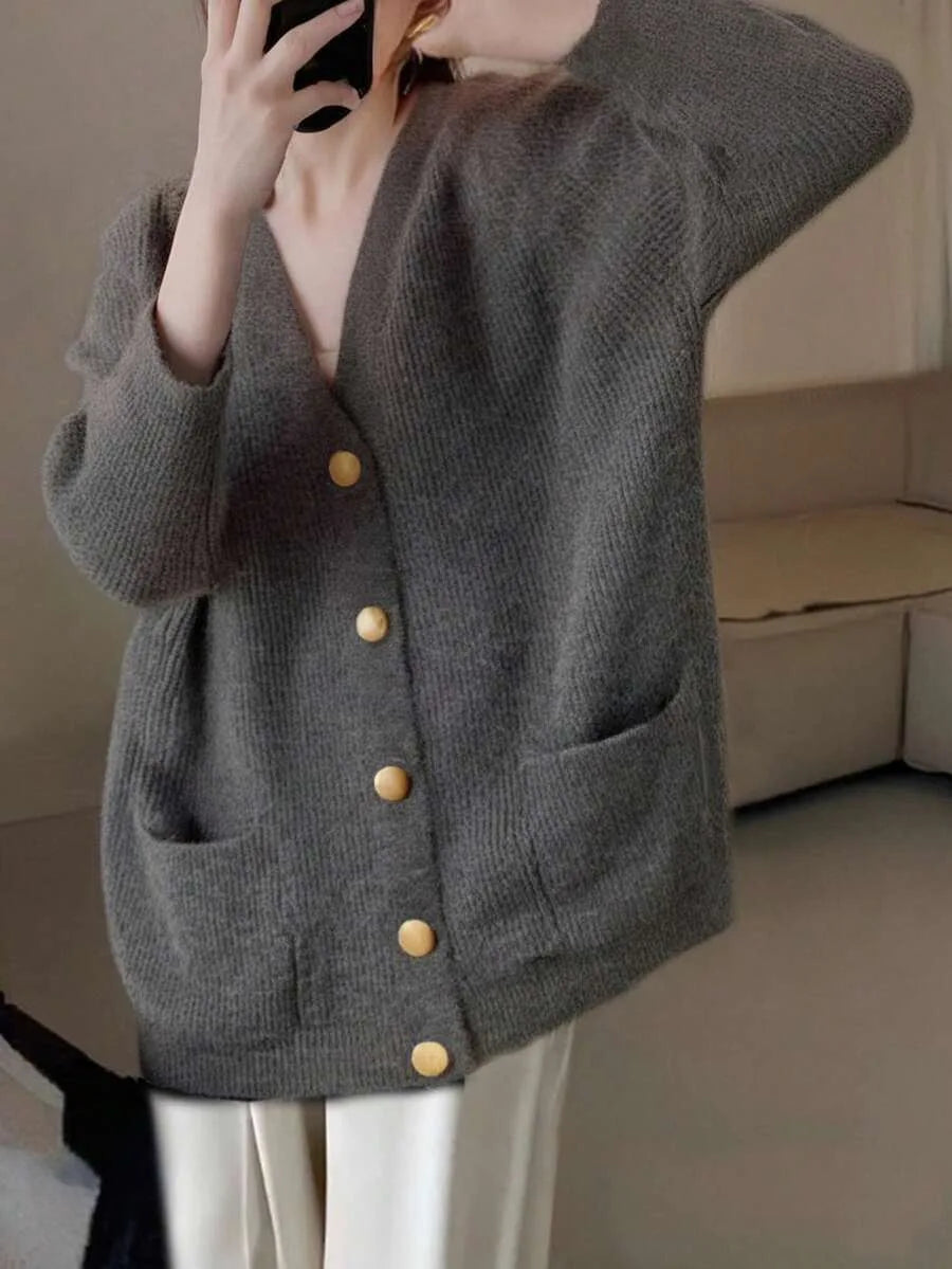 Margeaux oversized V-neck cardigan with front pockets, styled with leggings