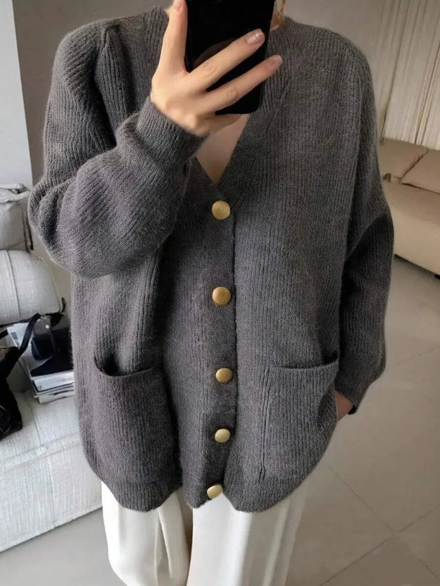Margeaux oversized V-neck cardigan with front pockets, styled with leggings