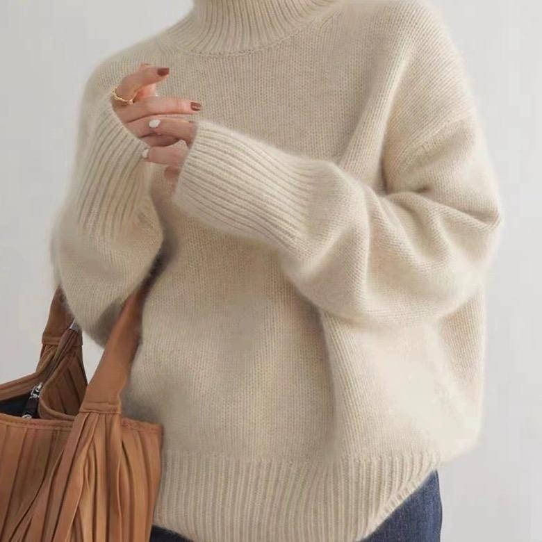 Margot turtleneck sweater in cream, front view with tote bag