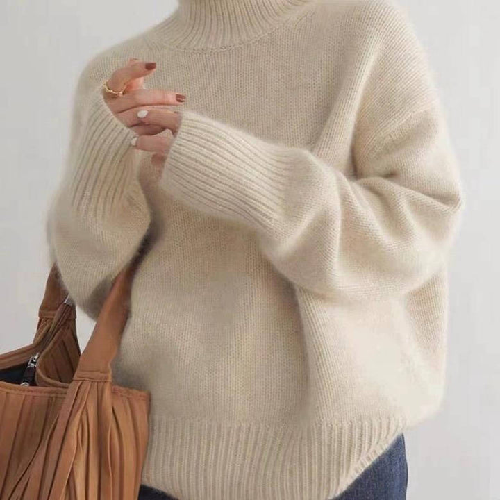 Margot turtleneck sweater in cream, front view with tote bag