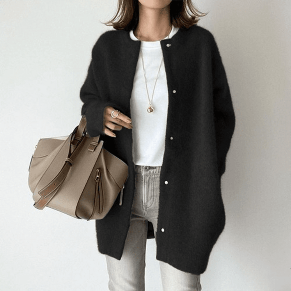 Margot oversized cardigan in black, styled with jeans and tote bag