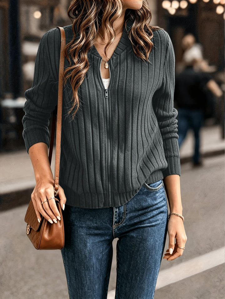 Marlowe ribbed zip-front cardigan in black, styled with crossbody bag