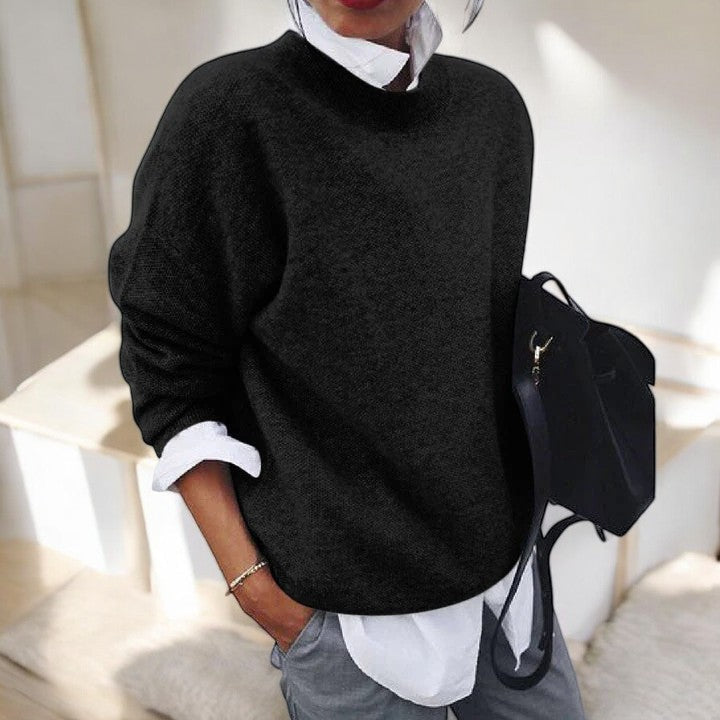 Molly oversized mock neck sweater in black, front view layered over white shirt