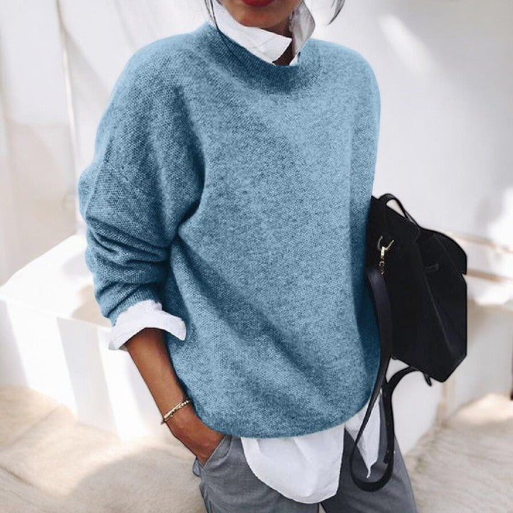 Molly oversized mock neck sweater in blue, front view layered over white shirt