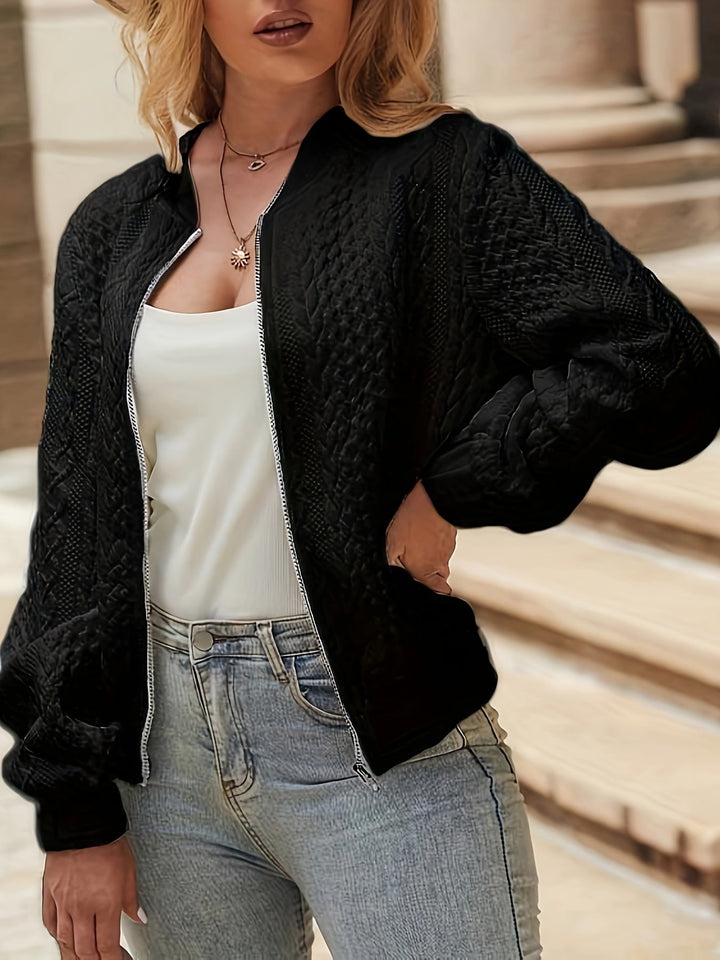 Quinn textured bomber jacket in black, front view zipped open over white top