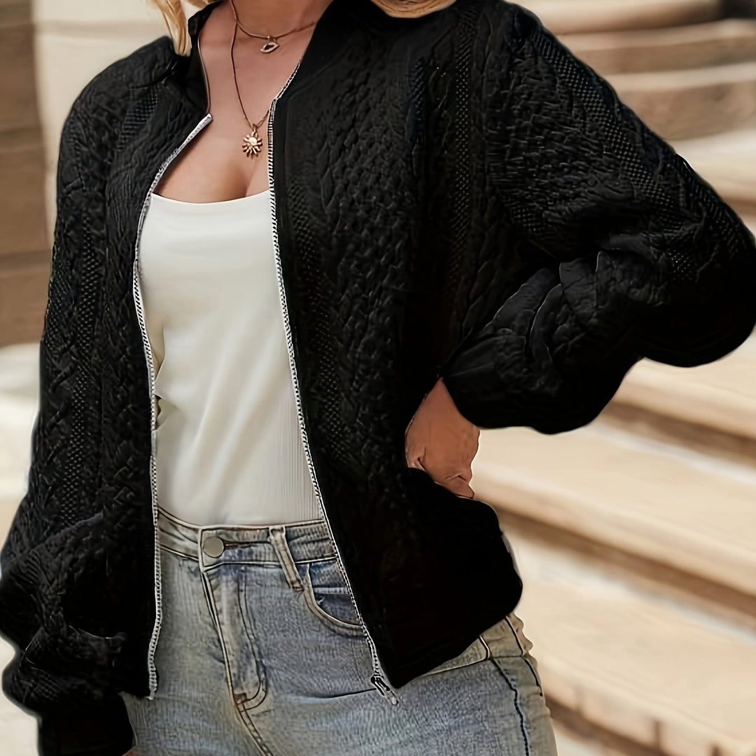 Quinn textured bomber jacket in black, front view with hand in pocket