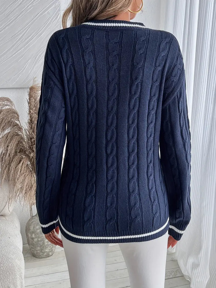 Rosalie cable knit sweater with striped cuffs, styled with white jeans