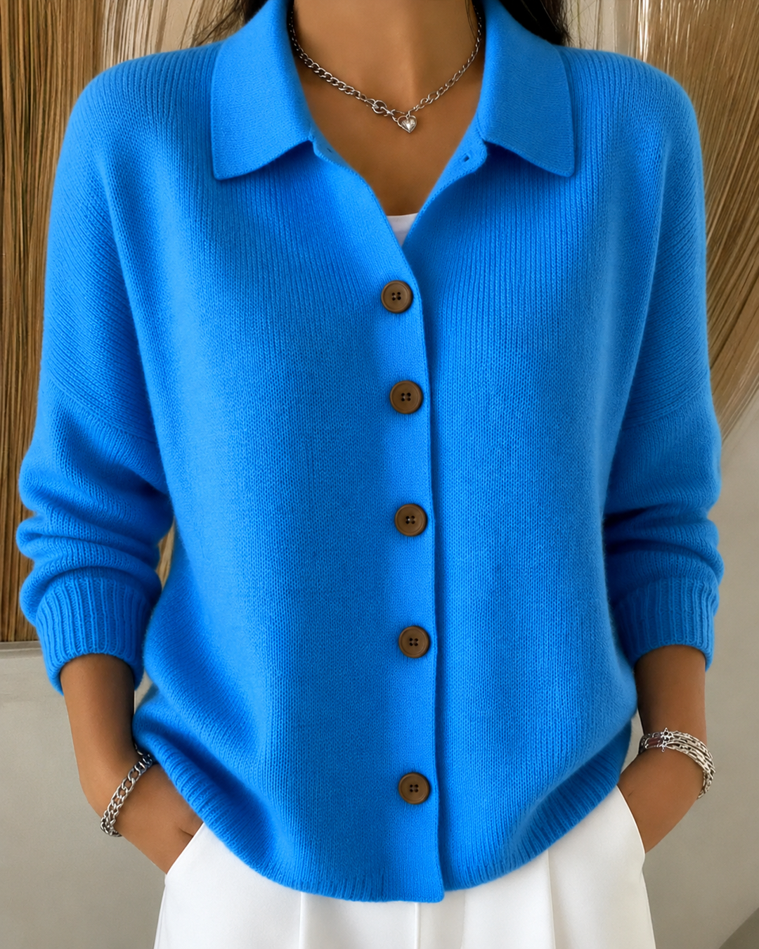 Sienna blue button collar cardigan, front view styled with white skirt