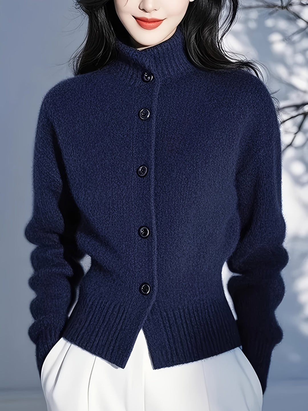 Simone high-neck button cardigan in navy, close-up back button and hem detail