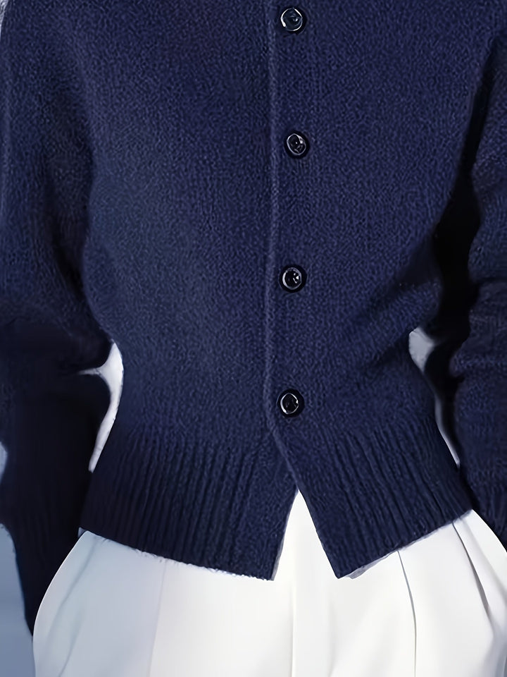 Simone high-neck button cardigan in navy, close-up back button and hem detail