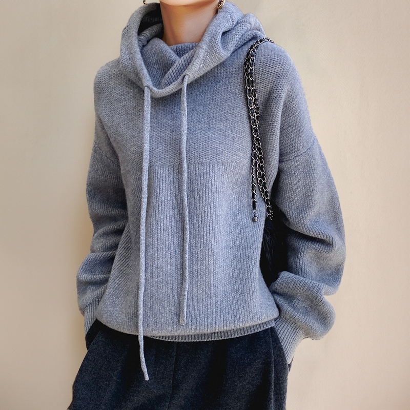 Sloane oversized turtleneck hoodie in blue-gray, styled with dark trousers