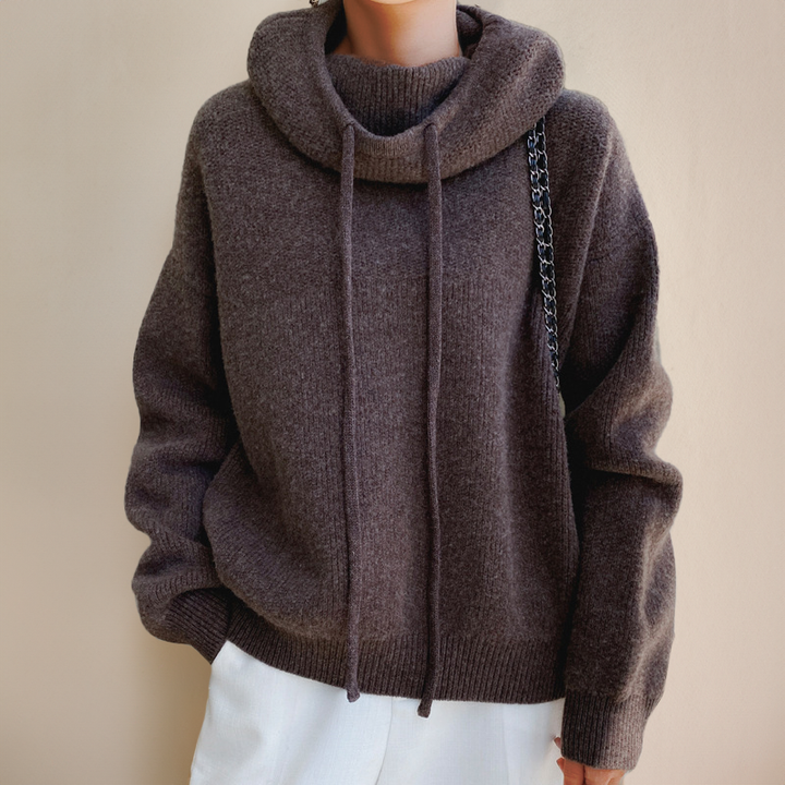 Sloane oversized hoodie in brown, styled with white pants and chain bag