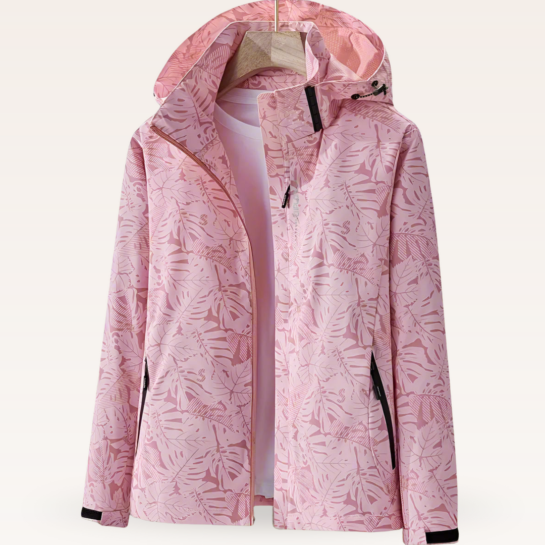 Thea hooded rain jacket in pink leaf print, front view on hanger