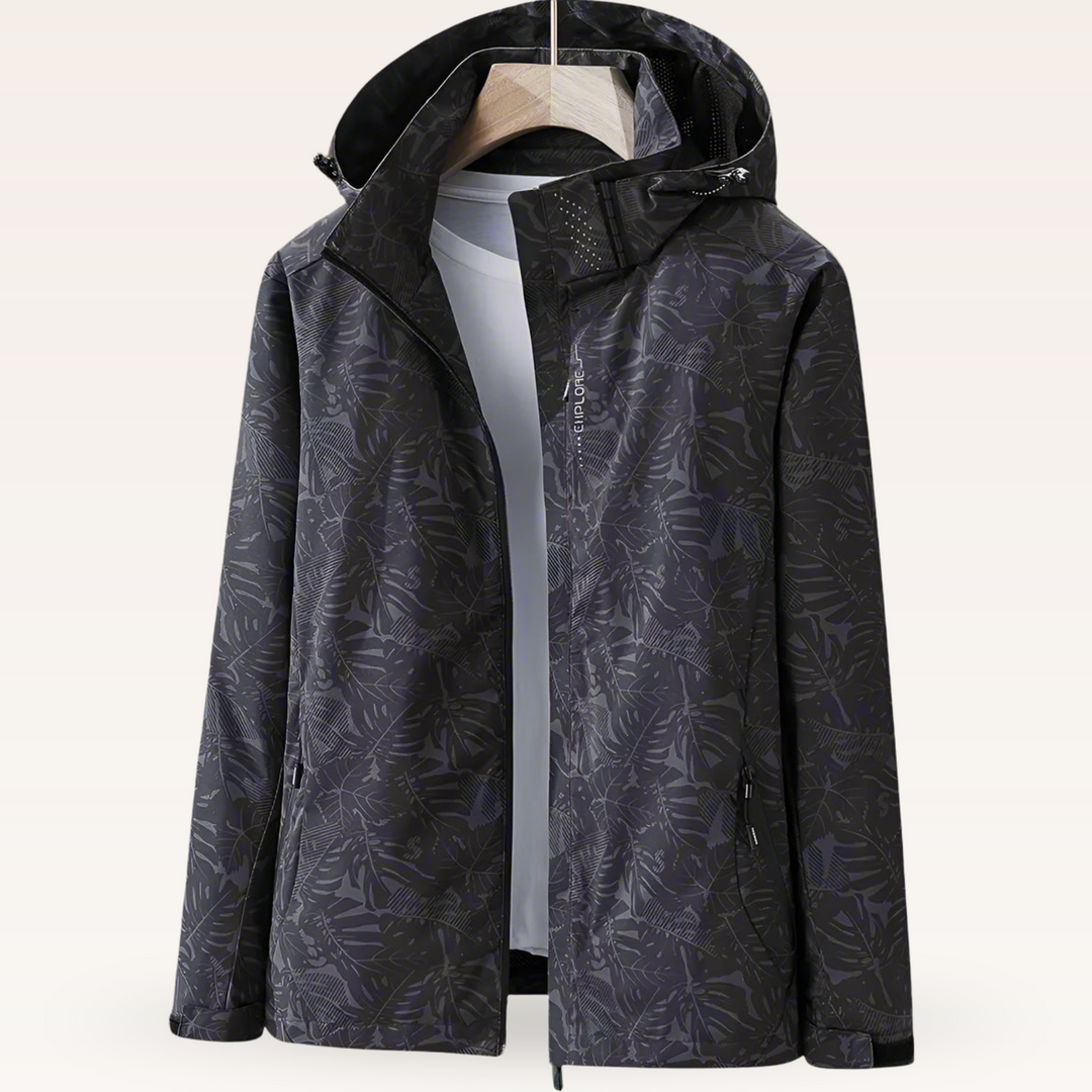Thea hooded rain jacket in pink leaf print, front view on hanger