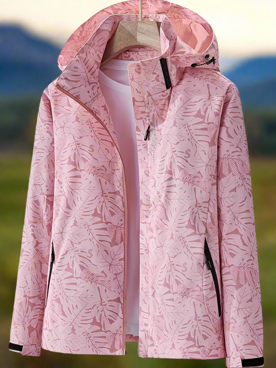 Thea hooded rain jacket in pink leaf print, front view on hanger