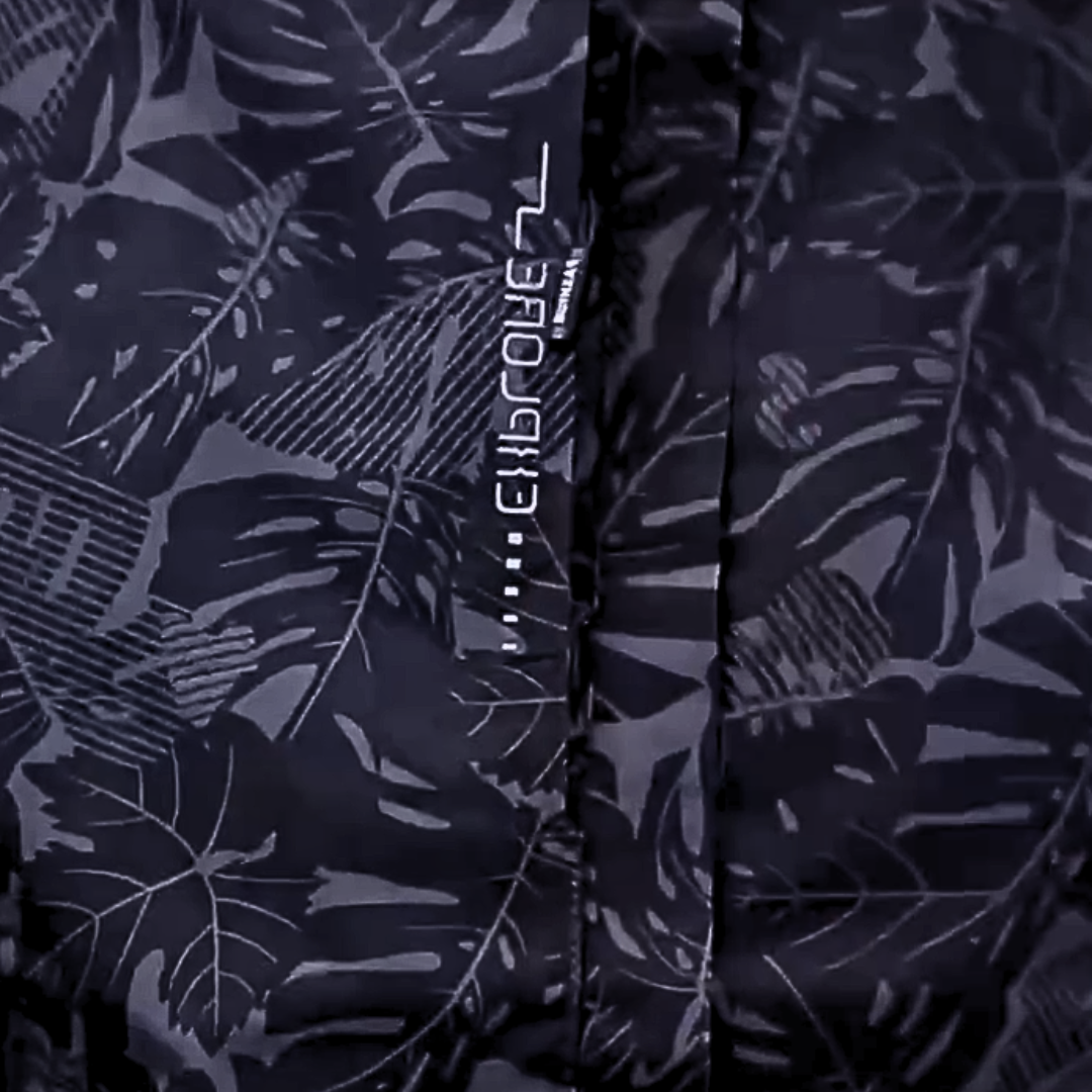 Thea hooded rain jacket in pink leaf print, front view on hanger
