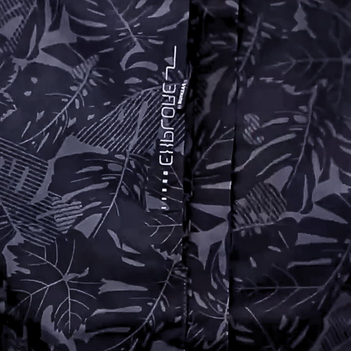 Thea hooded rain jacket in pink leaf print, front view on hanger