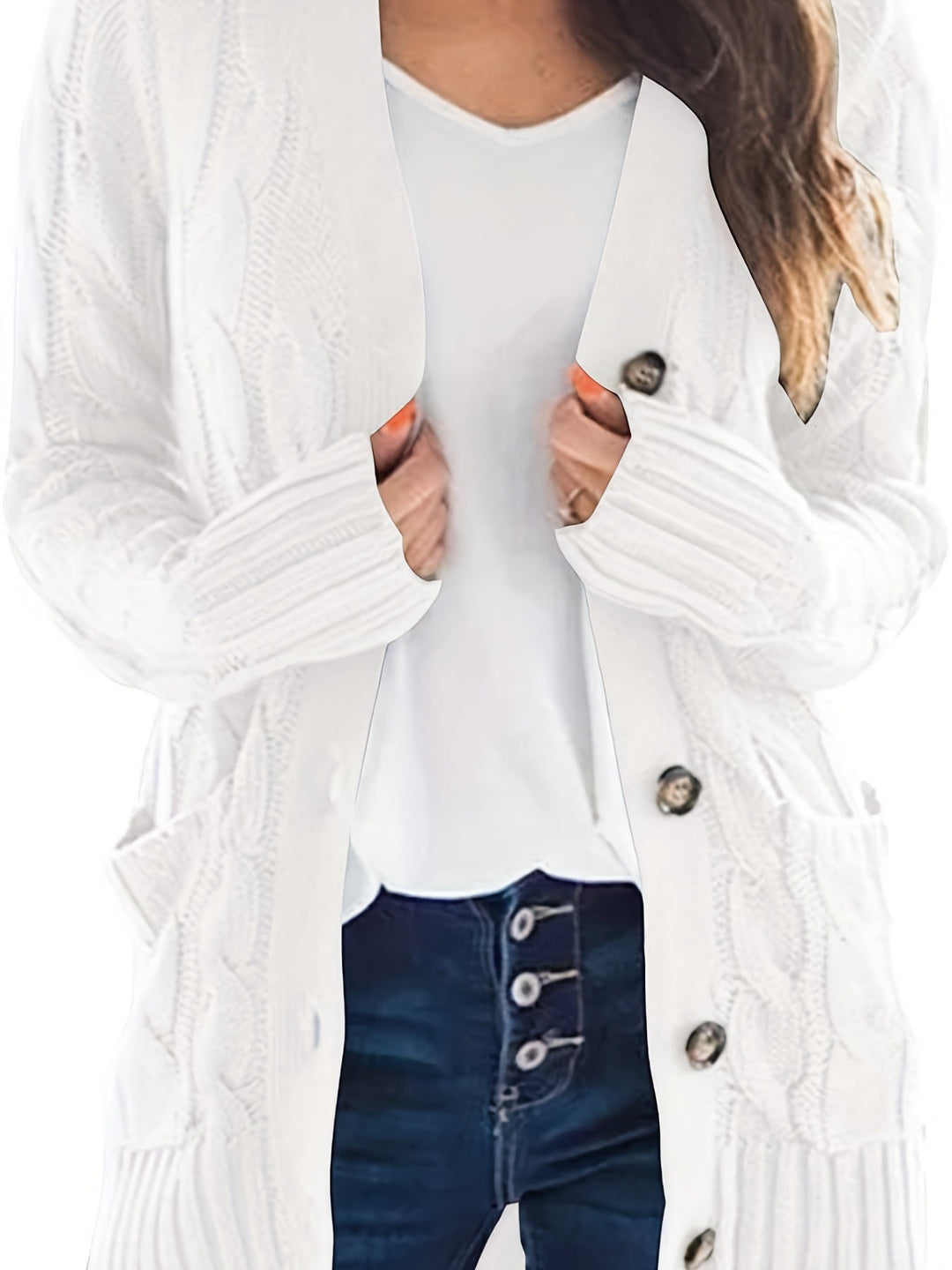 Vivienne cable knit button cardigan in white, front view with hands in pockets