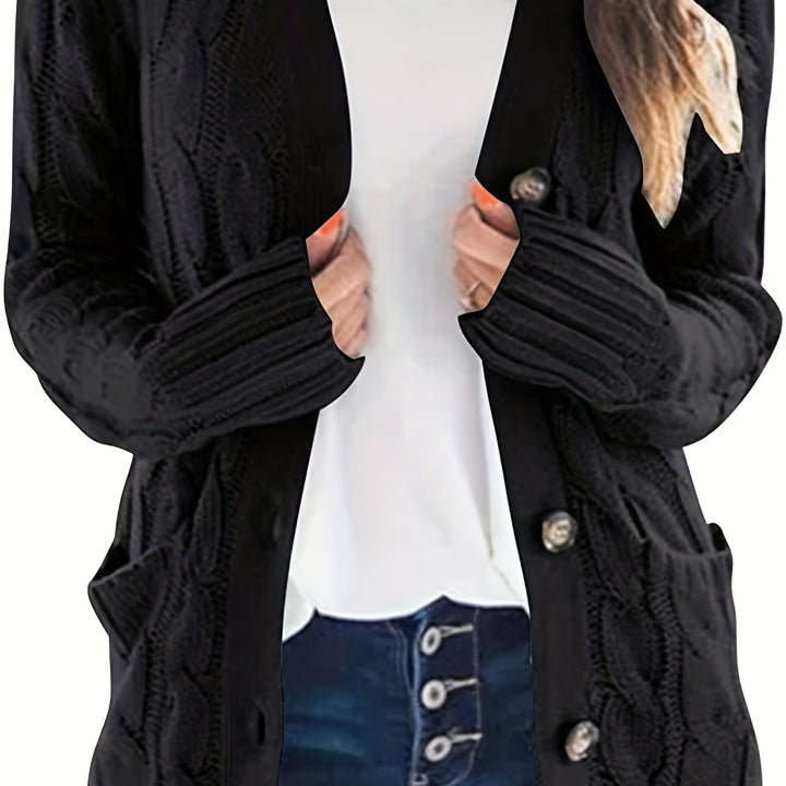 Vivienne cable knit button cardigan in black, front view with hands in pockets