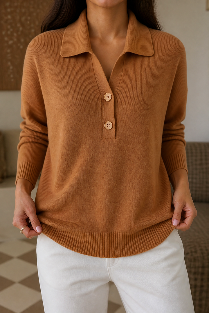 Wilhelmina pink collared pullover sweater styled with a trench coat and white pants
