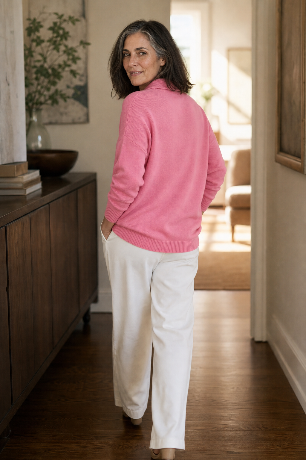 Wilhelmina pink collared pullover sweater styled with a trench coat and white pants