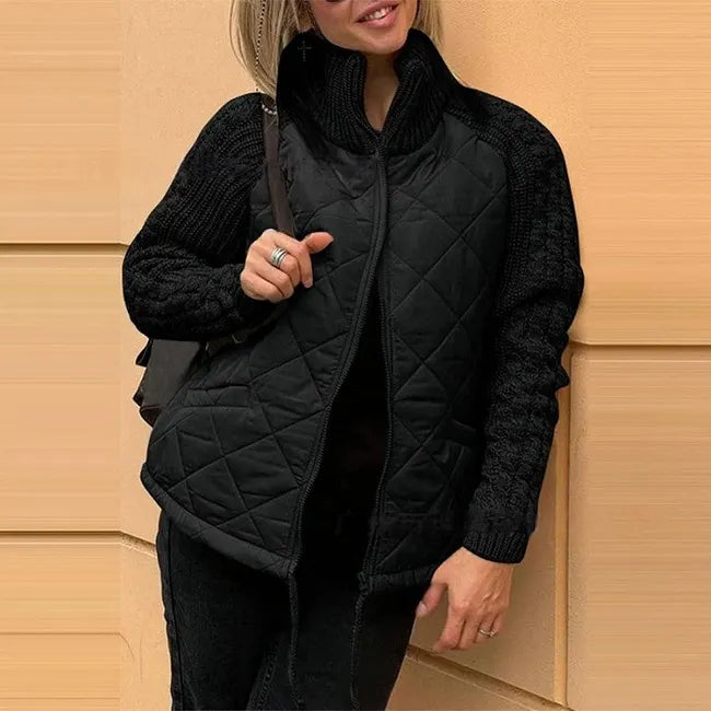 Winslet quilted stand collar jacket with knitted sleeves in black, front view