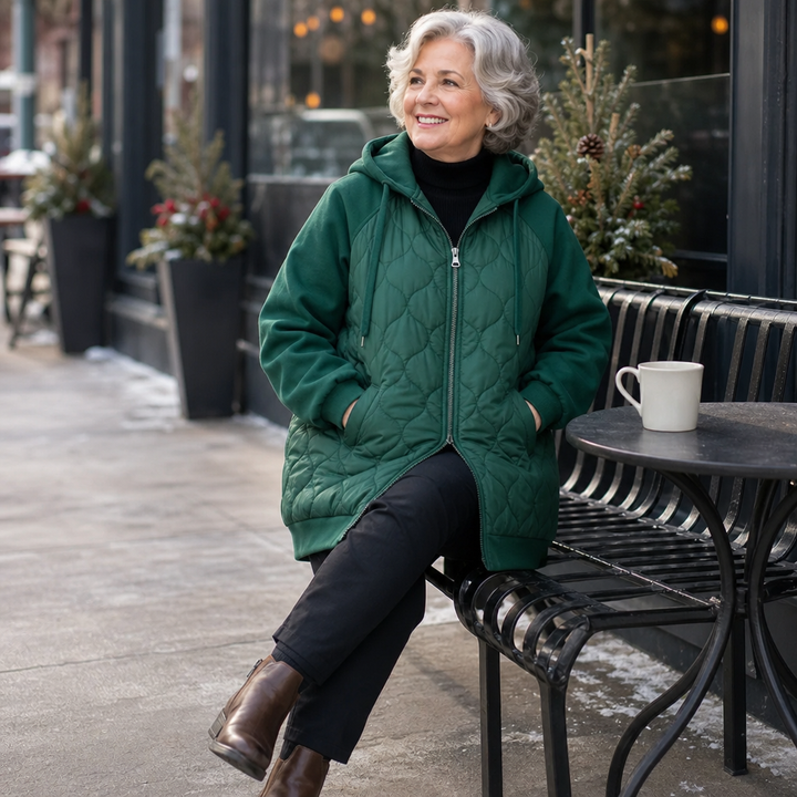 Winter dark green quilted hooded puffer jacket, seated outdoor view