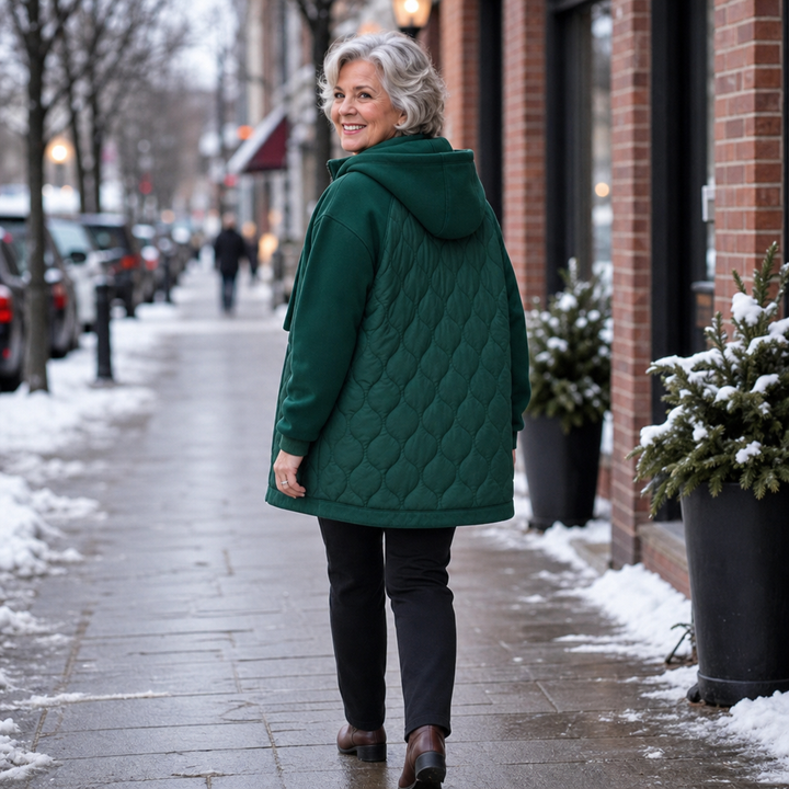 Winter dark green quilted hooded puffer jacket, seated outdoor view