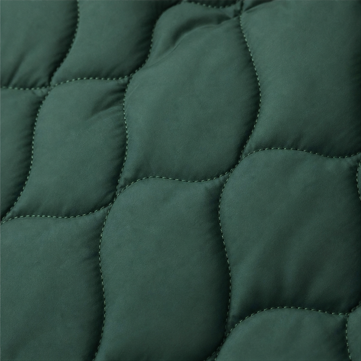 Winter dark green quilted hooded puffer jacket, seated outdoor view