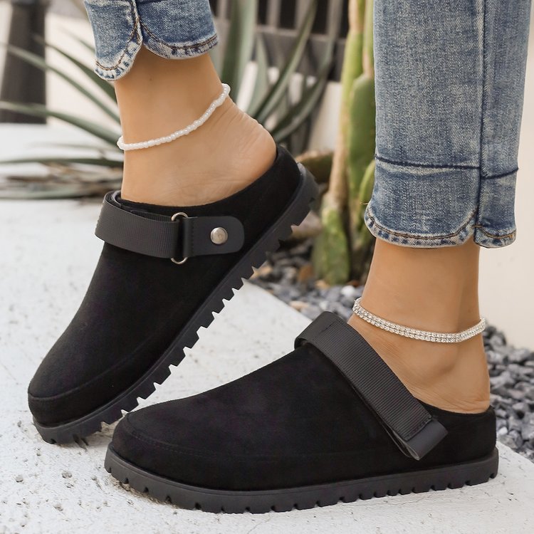 Thalia black adjustable strap platform clogs worn with jeans, side view