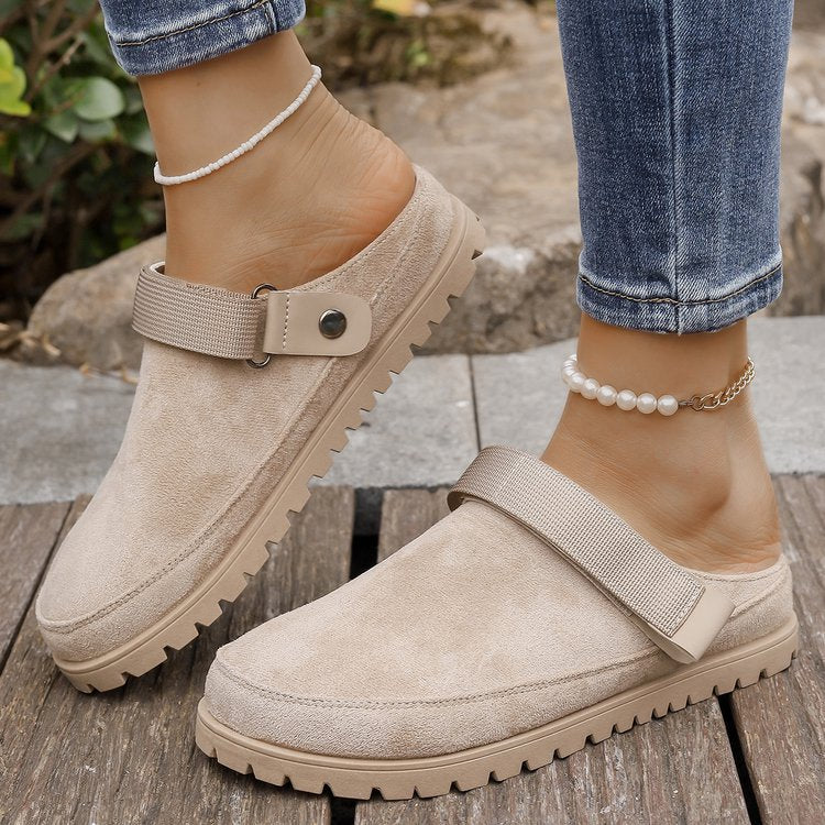 Thalia beige adjustable strap platform clogs worn with jeans, side view