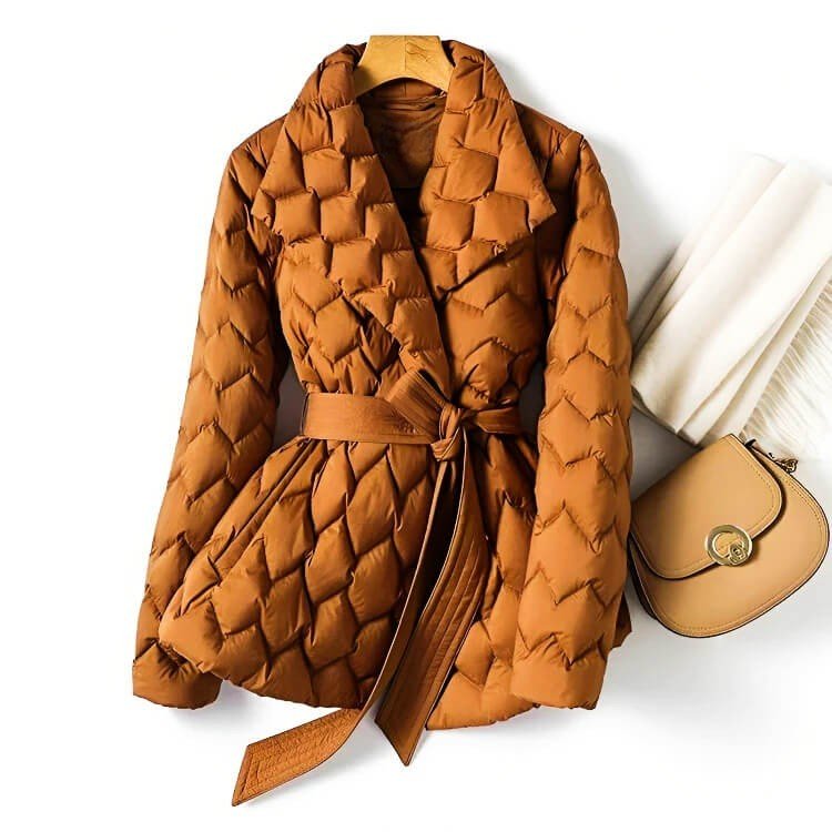 Guinevere belted quilted puffer jacket in amber, front view on hanger with scarf and bag