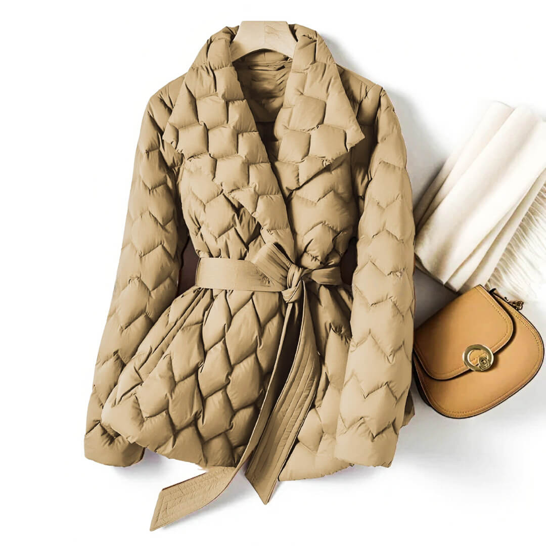 Guinevere belted quilted puffer jacket in beige, front view on hanger with scarf and bag